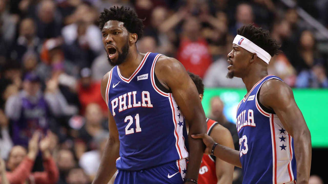 TORONTO, ON - DECEMBER 05: Joel Embiid #21 of the Philadelphia 76ers is restrained by Jimmy Butler #23 after receiving a technical foul in the fourth quarter from referee Jason Phillips #23 against the Toronto Raptors at Scotiabank Arena on December 5, 2018 in Toronto, Canada.