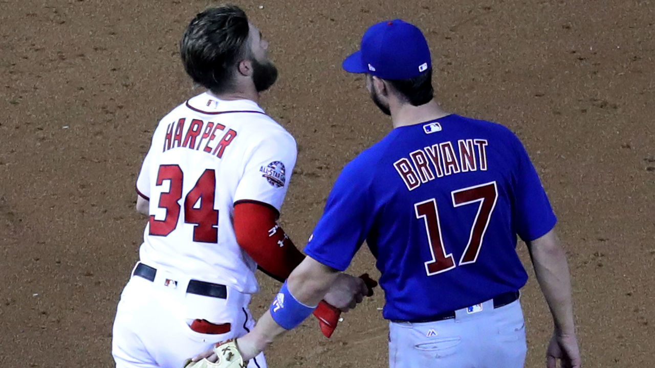 WASHINGTON, DC - SEPTEMBER 6: Bryce Harper #34 of the Washington Nationals talks with Kris Bryant #17 of the Chicago Cubs at Nationals Park on September 6, 2018 in Washington, DC.