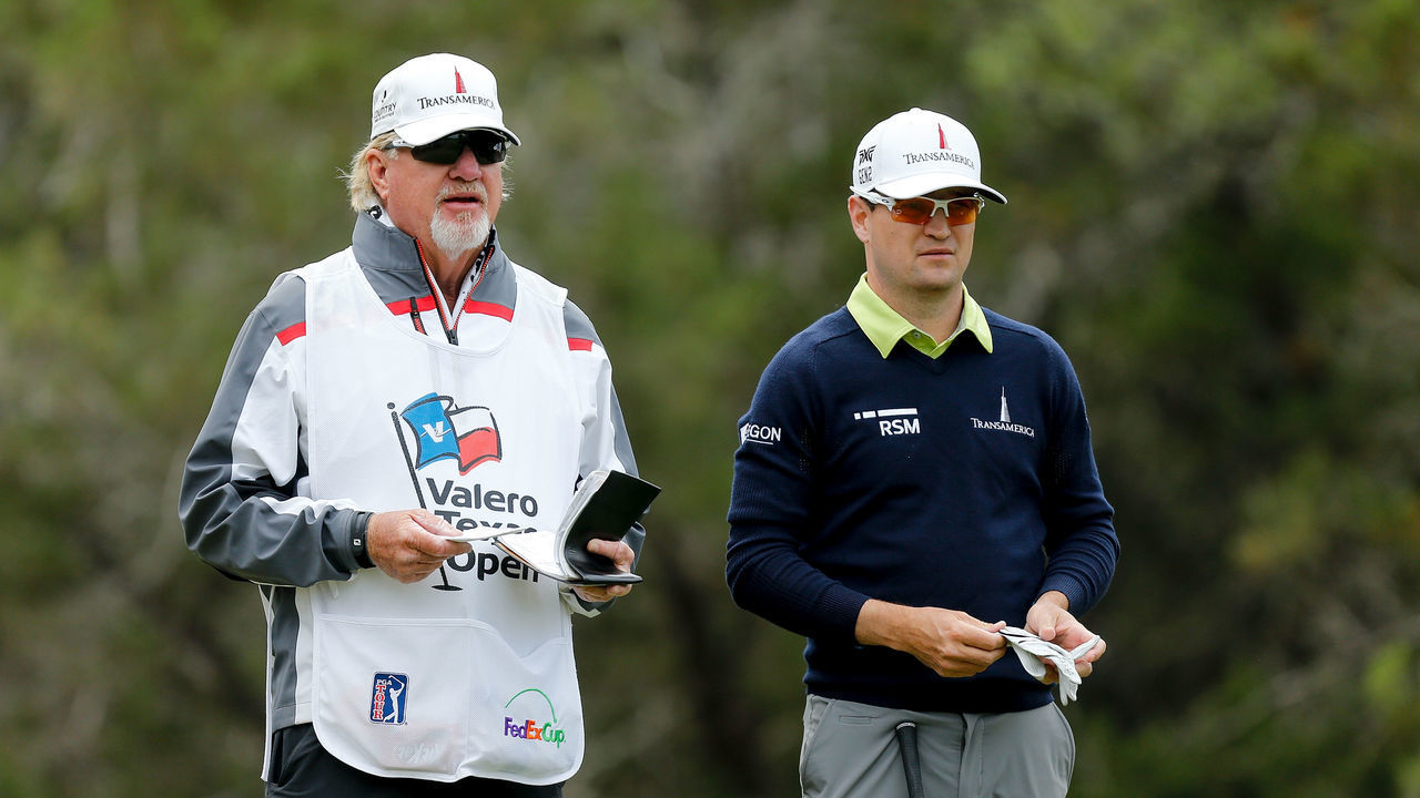 SAN ANTONIO, TX - APRIL 20: Zach Johnson talks with his caddie on the fifth hole during the second round of the Valero Texas Open at TPC San Antonio AT&T Oaks Course on April 19, 2018 in San Antonio, Texas.