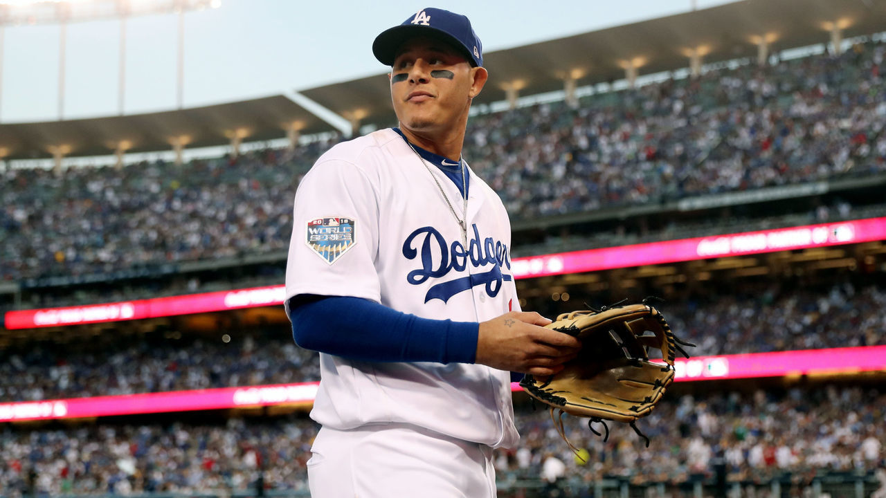 LOS ANGELES, CA - OCTOBER 26: Manny Machado #8 of the Los Angeles Dodgers walks back to the dugout during Game 3 of the 2018 World Series against the Boston Red Sox at Dodger Stadium on Friday, October 26, 2018 in Los Angeles, California.