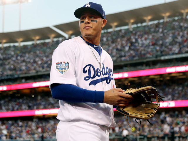 LOS ANGELES, CA - OCTOBER 26: Manny Machado #8 of the Los Angeles Dodgers walks back to the dugout during Game 3 of the 2018 World Series against the Boston Red Sox at Dodger Stadium on Friday, October 26, 2018 in Los Angeles, California.
