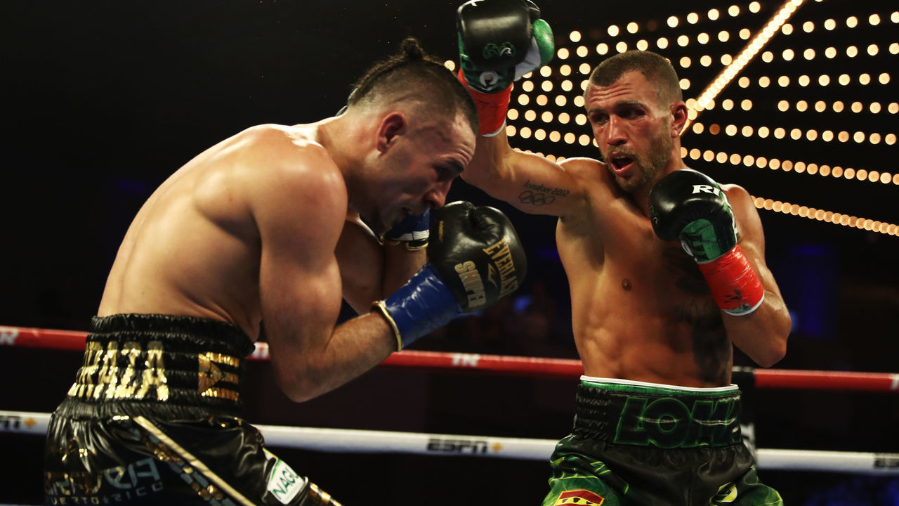 NEW YORK, NEW YORK - DECEMBER 08: Vasiliy Lomachenko punches Jose Pedraza during their WBA/WBO lightweight unification bout at The Hulu Theater at Madison Square Garden on December 08, 2018 in New York City.