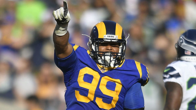 LOS ANGELES, CA - NOVEMBER 11: Aaron Donald #99 of the Los Angeles Rams celebrates sacking Russell Wilson #3 of the Seattle Seahawks in the at Los Angeles Memorial Coliseum on November 11, 2018 in Los Angeles, California.