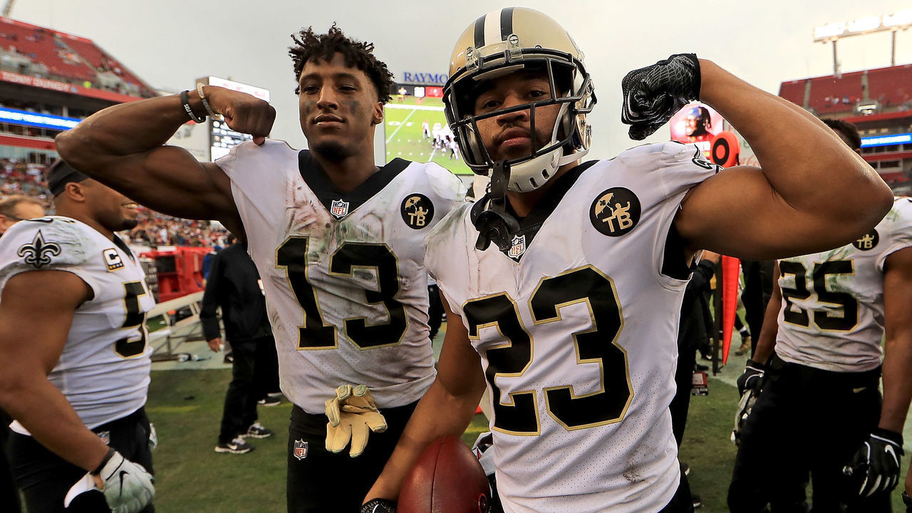 TAMPA, FL - DECEMBER 09: Michael Thomas #13 and Marshon Lattimore #23 of the New Orleans Saints reacts to a play during a game against the Tampa Bay Buccaneers at Raymond James Stadium on December 9, 2018 in Tampa, Florida.