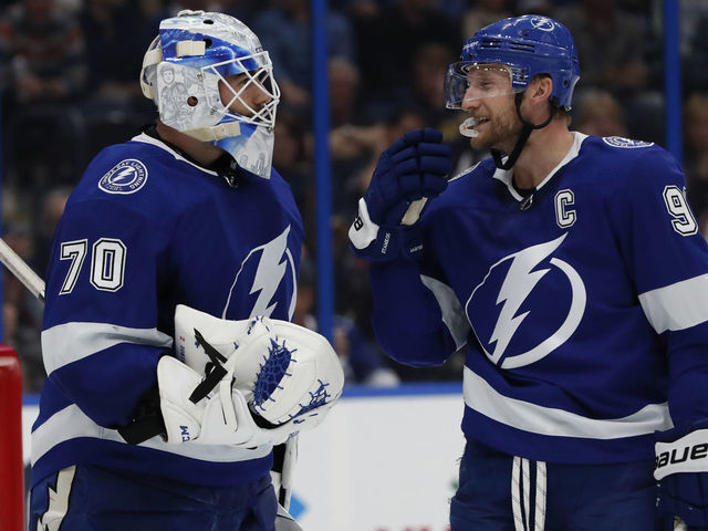 TAMPA, FL - DECEMBER 08: Tampa Bay Lightning goaltender Louis Domingue (70) talks to Tampa Bay Lightning center Steven Stamkos (91) in the third period of the NHL game between the Colorado Avalanche and Tampa Bay Lightning on December 08, 2018 at Amalie Arena in Tampa,FL.