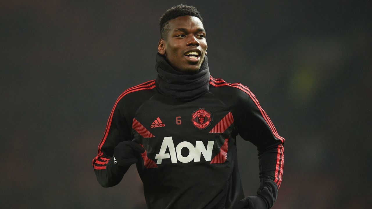 Manchester United's French midfielder Paul Pogba warms up before kick off of the English Premier League football match between Manchester United and Arsenal at Old Trafford in Manchester, north west England, on December 5, 2018.