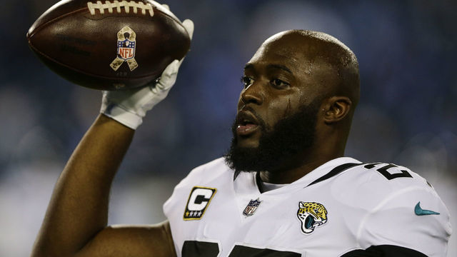 NASHVILLE, TN - DECEMBER 6: Leonard Fournette #27 of the Jacksonville Jaguars tosses a ball to a fan before the game against the Tennessee Titans at Nissan Stadium on December 6, 2018 in Nashville, Tennessee.