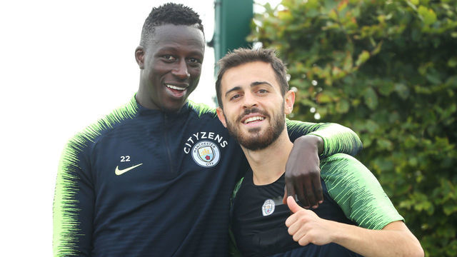 MANCHESTER, ENGLAND - AUGUST 30: Manchester City's Benjamin Mendy poses with Bernardo Silva during training at Manchester City Football Academy on August 30, 2018 in Manchester, England.