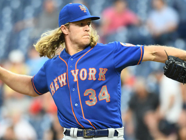 PHILADELPHIA, PA - SEPTEMBER 19: New York Mets Starting pitcher Noah Syndergaard (34) winds up to pitch during the MLB game between the New York Mets and the Philadelphia Phillies on September 19, 2018, at Citizens Bank Park in Philadelphia, PA.