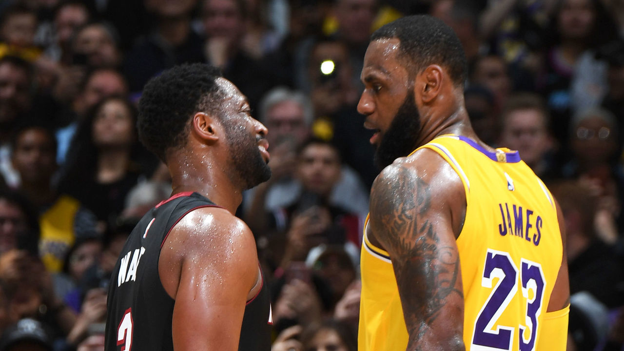 LOS ANGELES, CA - DECEMBER 10: LeBron James #23 of the Los Angeles Lakers speaks with Dwyane Wade #3 of the Miami Heat on December 10, 2018 at STAPLES Center in Los Angeles, California. NOTE TO USER: User expressly acknowledges and agrees that, by downloading and/or using this Photograph, user is consenting to the terms and conditions of the Getty Images License Agreement. Mandatory Copyright Notice: Copyright 2018 NBAE