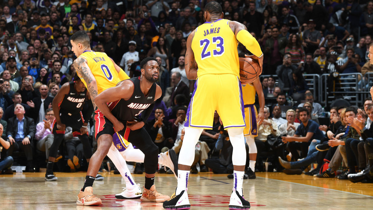 LOS ANGELES, CA - DECEMBER 10: LeBron James #23 of the Los Angeles Lakers handles the ball against Dwyane Wade #3 of the Miami Heat on December 10, 2018 at STAPLES Center in Los Angeles, California. NOTE TO USER: User expressly acknowledges and agrees that, by downloading and/or using this Photograph, user is consenting to the terms and conditions of the Getty Images License Agreement. Mandatory Copyright Notice: Copyright 2018 NBAE