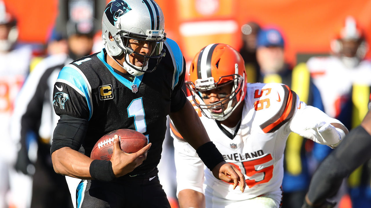 CLEVELAND, OH - DECEMBER 09: Cam Newton #1 of the Carolina Panthers carries the ball in front of Myles Garrett #95 of the Cleveland Browns during the first quarter at FirstEnergy Stadium on December 9, 2018 in Cleveland, Ohio.