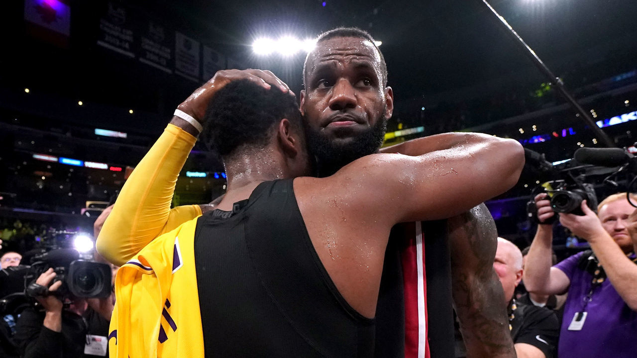 LOS ANGELES, CA - DECEMBER 10: LeBron James #23 of the Los Angeles Lakers hugs Dwyane Wade #3 of the Miami Heat, in Wade's last regular season game visit to Staples Center, after a 108-105 Laker win at Staples Center on December 10, 2018 in Los Angeles, California.