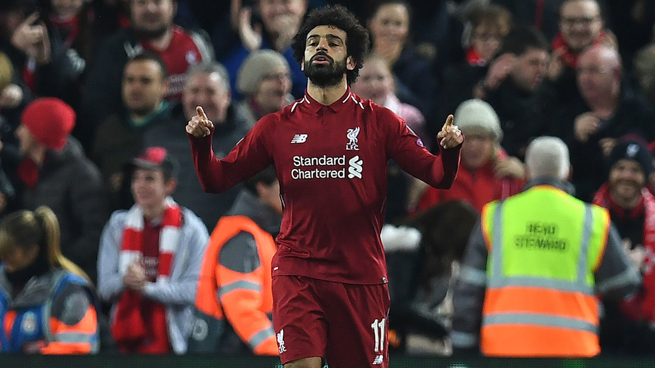 Liverpool's Egyptian midfielder Mohamed Salah celebrates scoring the opening goal during the UEFA Champions League group C football match between Liverpool and Napoli at Anfield stadium in Liverpool, north west England on December 11, 2018.