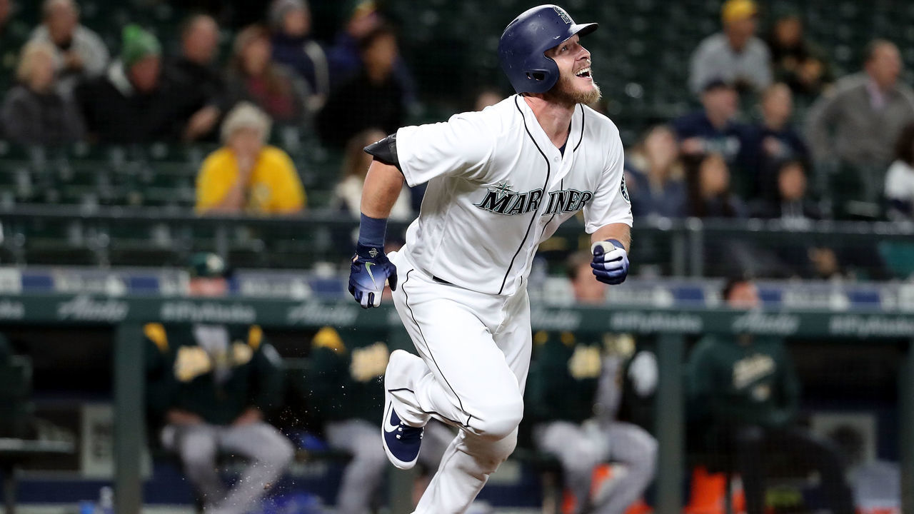 SEATTLE, WA - SEPTEMBER 25: Chris Herrmann #26 of the Seattle Mariners watches his two run home run against the Oakland Athletics in the eleventh inning to win the game 10-8 during their game at Safeco Field on September 25, 2018 in Seattle, Washington.