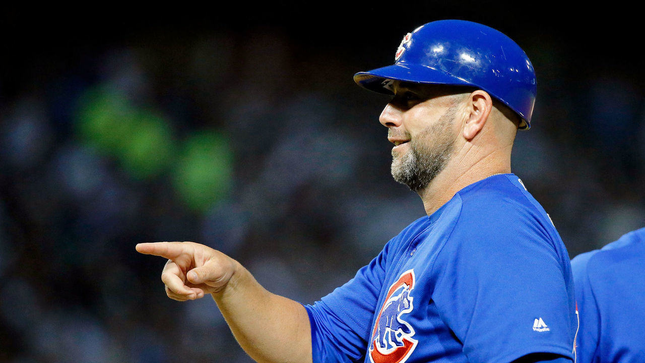 CHICAGO, IL - JULY 26: First base coach Brandon Hyde #16 points to the dugout after Kyle Schwarber #12 (R) hit an RBI single against the Chicago White Sox during the fourth inning at Guaranteed Rate Field on July 26, 2017 in Chicago, Illinois. The Chicago Cubs won 8-3.