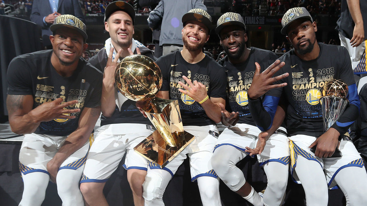 CLEVELAND, OH - JUNE 8: Andre Iguodala #9, Klay Thompson #11, Stephen Curry #30, Draymond Green #23, and Kevin Durant #35 of the Golden State Warriors pose with the Larry O'Brien Championship Trophy after Game Four of the 2018 NBA Finals against the Cleveland Cavaliers on June 8, 2018 at Quicken Loans Arena in Cleveland, Ohio. NOTE TO USER: User expressly acknowledges and agrees that, by downloading and/or using this photograph, user is consenting to the terms and conditions of the Getty Images License Agreement. Mandatory Copyright Notice: Copyright 2018 NBAE