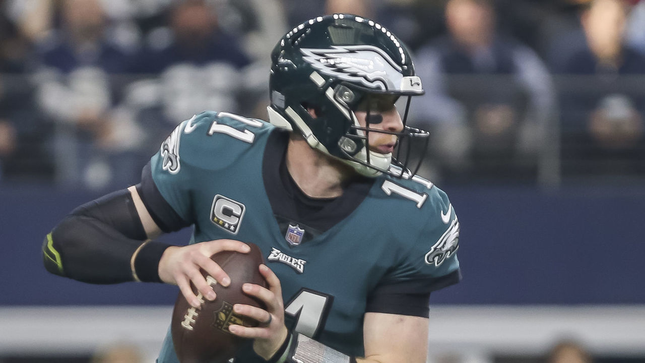 ARLINGTON, TX - DECEMBER 09: Philadelphia Eagles quarterback Carson Wentz (11) looks downfield for an open receiver during the game between the Dallas Cowboys and the Philadelphia Eagles on December 9, 2018 at AT&T Stadium in Arlington. Texas.