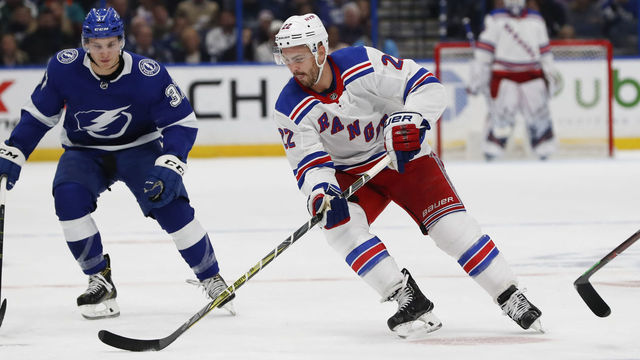 TAMPA, FL - DECEMBER 10: New York Rangers defenseman Kevin Shattenkirk (22) skates with the puck in the first period of the NHL game between the New York Rangers and Tampa Bay Lightning on December 10, 2018 at Amalie Arena in Tampa,FL.