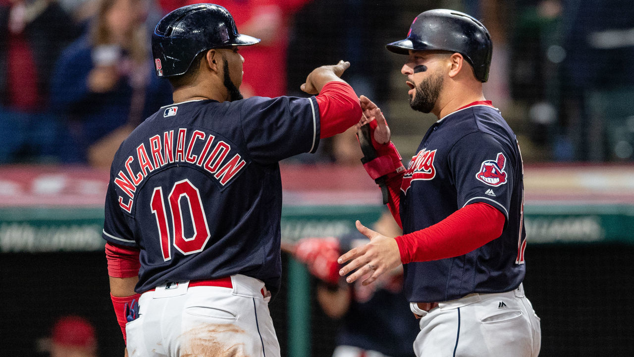 CLEVELAND, OH - SEPTEMBER 23: Edwin Encarnacion #10 celebrates with Yonder Alonso #17 of the Cleveland Indians after both scored on a double by Melky Cabrera #53 during the fourth inning against the Boston Red Sox at Progressive Field on September 23, 2018 in Cleveland, Ohio.