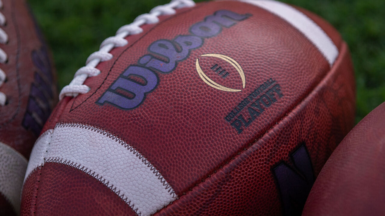 WEST LAFAYETTE, IN - AUGUST 30: The college football playoff logo on a ball laying on the field before the college football game between the Purdue Boilermakers and Northwestern Wildcats on August 30, 2018, at Ross-Ade Stadium in West Lafayette, IN.