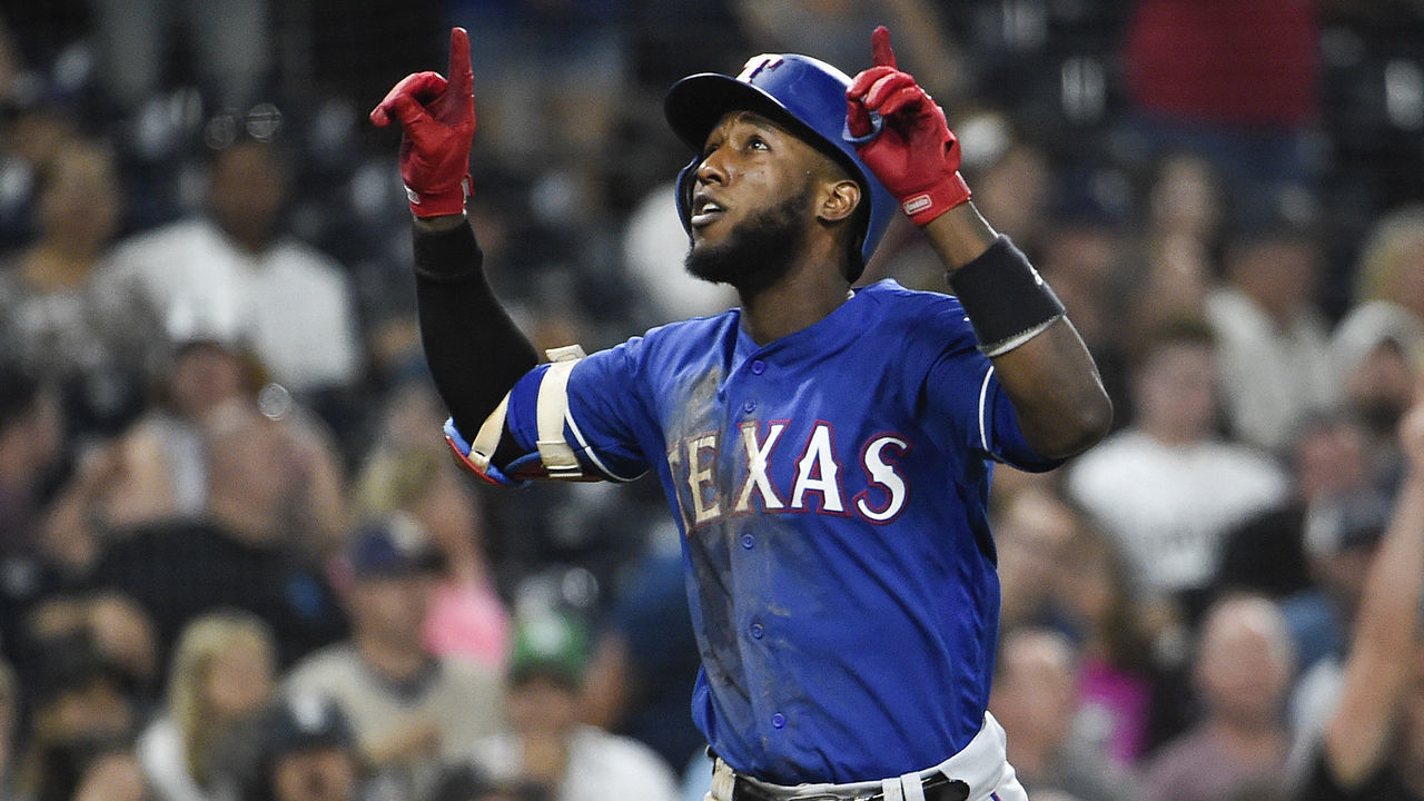 SAN DIEGO, CA - SEPTEMBER 14: Jurickson Profar #19 of the Texas Rangers celebrates after hitting a two-run home run during the seventh inning of a baseball game against the San Diego Padres at PETCO Park on September 14, 2018 in San Diego, California.