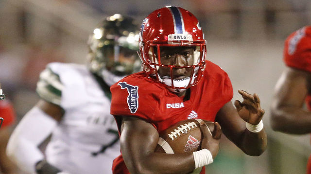 BOCA RATON, FL - NOVEMBER 24: Devin Singletary #5 of the Florida Atlantic Owls runs with the ball against the Charlotte 49ers on November 24, 2018 at FAU Stadium in Boca Raton, Florida. Charlotte defeated FAU 27-24.
