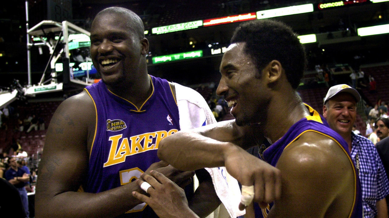 031390.SP.0613.lakers9.WS  Lakers Shaquille O'Neal and Kobe Bryant celebrate after defeating the 76ers in Game 4 of the NBA Finals in Philadelphia Wednesday June 13, 2001.
