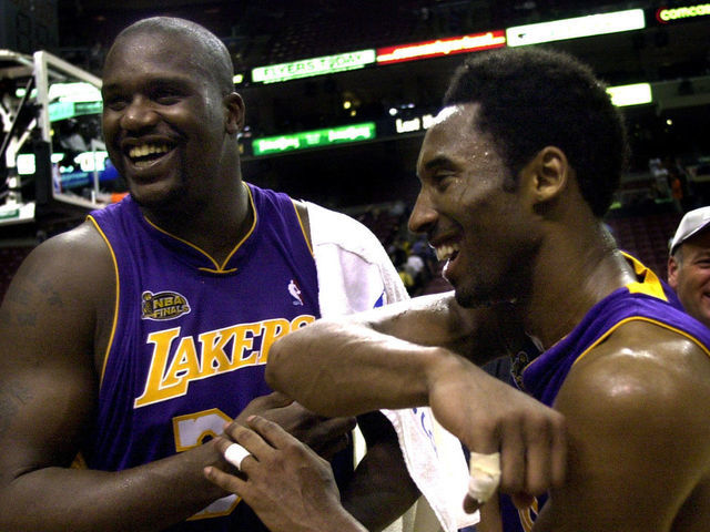 031390.SP.0613.lakers9.WS Lakers Shaquille O'Neal and Kobe Bryant celebrate after defeating the 76ers in Game 4 of the NBA Finals in Philadelphia Wednesday June 13, 2001.