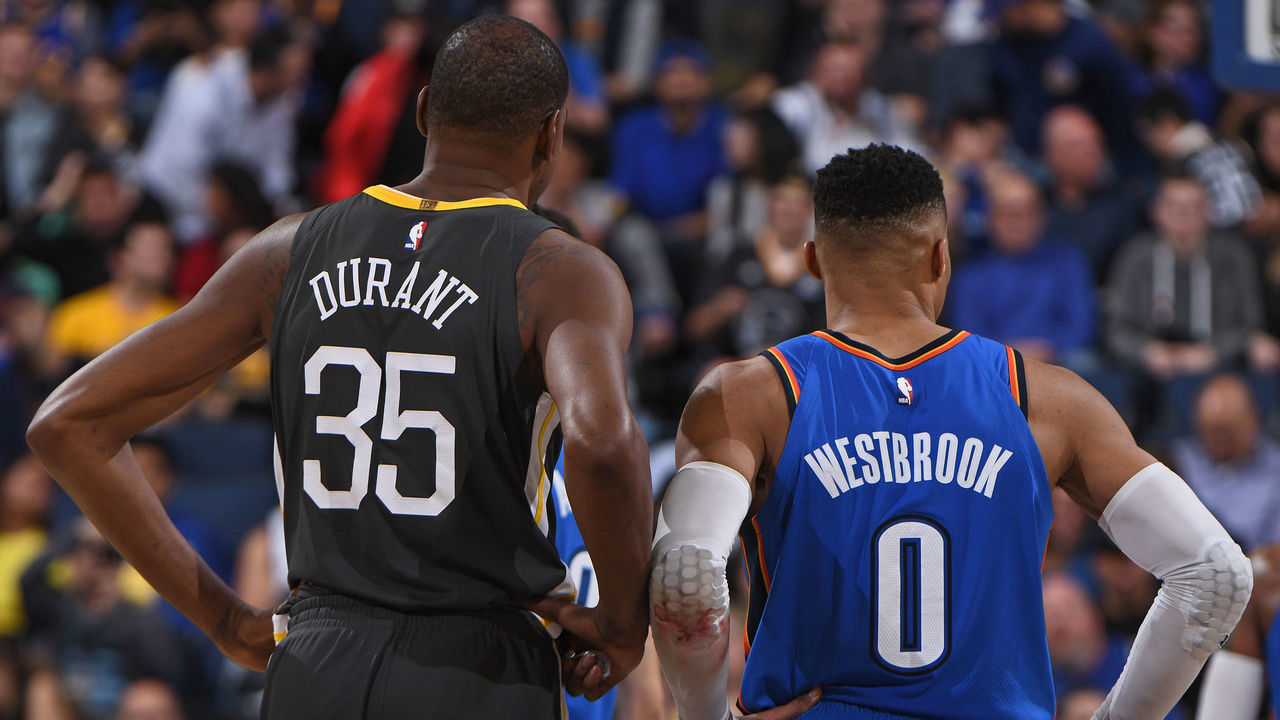 OAKLAND, CA - FEBRUARY 6: Kevin Durant #35 of the Golden State Warriors and Russell Westbrook #0 of the Oklahoma City Thunder stand on the court during the game on February 6, 2018 at ORACLE Arena in Oakland, California. NOTE TO USER: User expressly acknowledges and agrees that, by downloading and or using this photograph, user is consenting to the terms and conditions of Getty Images License Agreement. Mandatory Copyright Notice: Copyright 2018 NBAE