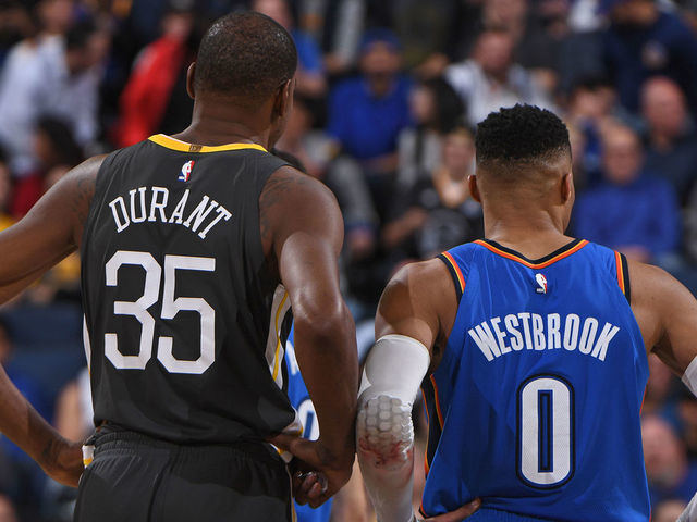 OAKLAND, CA - FEBRUARY 6: Kevin Durant #35 of the Golden State Warriors and Russell Westbrook #0 of the Oklahoma City Thunder stand on the court during the game on February 6, 2018 at ORACLE Arena in Oakland, California. NOTE TO USER: User expressly acknowledges and agrees that, by downloading and or using this photograph, user is consenting to the terms and conditions of Getty Images License Agreement. Mandatory Copyright Notice: Copyright 2018 NBAE