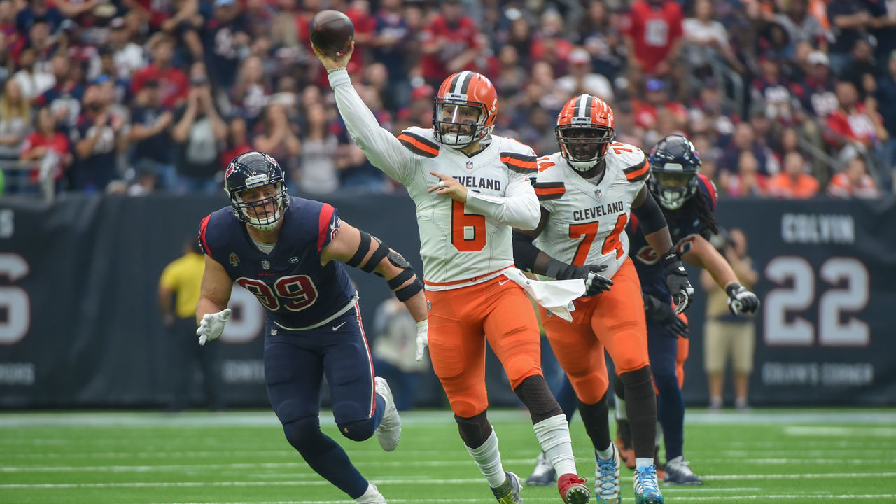 HOUSTON, TX - DECEMBER 02: Cleveland Browns Quarterback Baker Mayfield (6) scrambles from the pocket then throws over the middle as Houston Texans Defensive End J.J. Watt (99) gives chase during the football game between the Cleveland Browns and Houston Texans on December 2, 2018 at NRG Stadium in Houston, Texas.