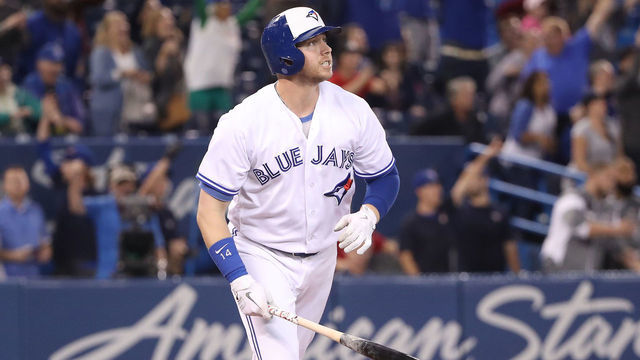 TORONTO, ON - SEPTEMBER 20: Justin Smoak #14 of the Toronto Blue Jays watches as he hits a game-winning solo home run in the ninth inning during MLB game action against the Tampa Bay Rays at Rogers Centre on September 20, 2018 in Toronto, Canada.