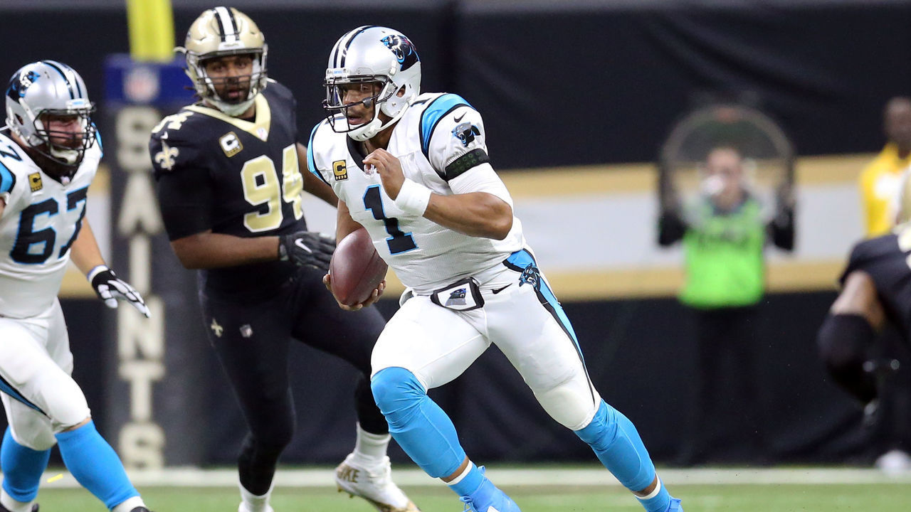 NEW ORLEANS, LA - JANUARY 07: Cam Newton #1 of the Carolina Panthers runs the ball against Cameron Jordan #94 of the New Orleans Saints during the first half of the NFC Wild Card playoff game at the Mercedes-Benz Superdome on January 7, 2018 in New Orleans, Louisiana.
