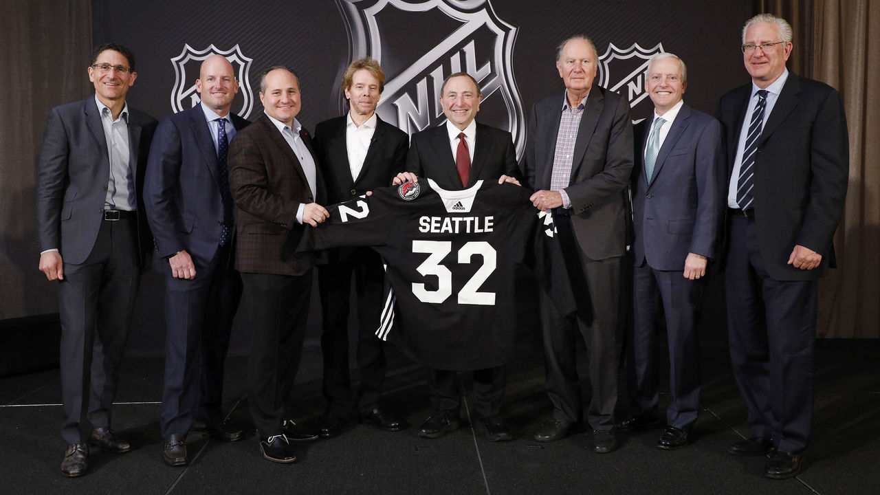 SEA ISLAND, GA - DECEMBER 04: (L to R) Adrian Hanauer, NHL Seattle franchise Vice-Chairman David Wright, Jay Deutsch, Jerry Bruckheimer, NHL Commissioner Gary Bettman, NHL Seattle franchise majority owner David Bonderman, Len Potter, and NHL Seattle franchise President and CEO Tod Leiweke pose for a photo during the NHL Board of Governors Meeting on December 4, 2018 in Sea Island, Georgia. The NHL Board of Governors approved expanding to Seattle, making the franchise the 32nd team in the league.