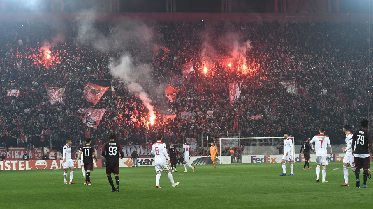 Olympiakos' fans celebrates during their UEFA league match Olympiacos FC and AC Milan at the Karaiskaki stadium in Piraeus on December 13, 2018.