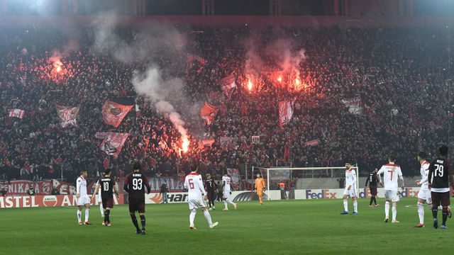 Olympiakos' fans celebrates during their UEFA league match Olympiacos FC and AC Milan at the Karaiskaki stadium in Piraeus on December 13, 2018.