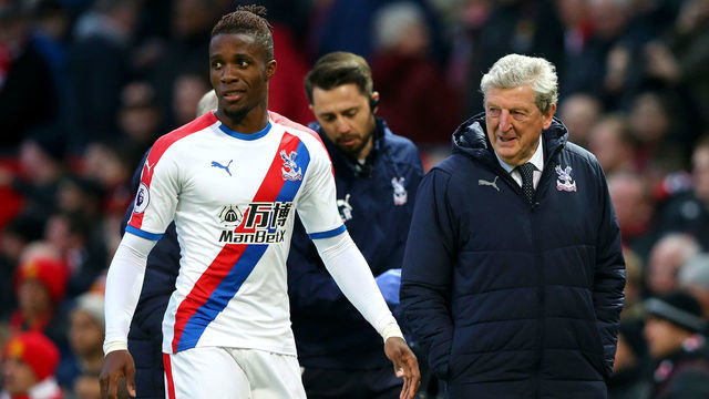 MANCHESTER, ENGLAND - NOVEMBER 24: Wilfried Zaha of Crystal Palace speaks with Roy Hodgson, Manager of Crystal Palace following their sides draw in the Premier League match between Manchester United and Crystal Palace at Old Trafford on November 24, 2018 in Manchester, United Kingdom.