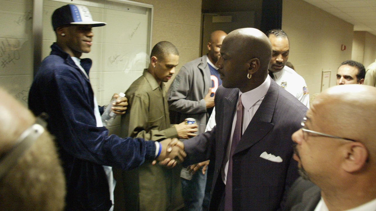 CLEVELAND - APRIL 8: High school phenomenon LeBron James #23 of the St. Vincent-St. Mary Fighting Irish shakes hands with Michael Jordan #23 of the Washington Wizards after Jordan's game against the Cleveland Cavaliers at Gund Arena on April 8, 2003 in Cleveland, Ohio. The Wizards won 100-91. NOTE TO USER: User expressly acknowledges and agrees that, by downloading and/or using this Photograph, User is consenting to the terms and conditions of the Getty Images License Agreement. Copyright 2003 NBAE
