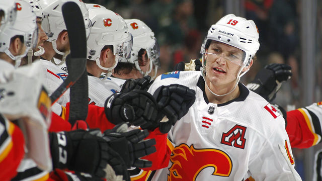 ST. PAUL, MN - DECEMBER 15: Matthew Tkachuk #19 of the Calgary Flames celebrates his 3rd period and eventual game-winning goal during a game with the Minnesota Wild at Xcel Energy Center on December 15, 2018 in St. Paul, Minnesota.