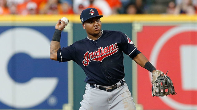 HOUSTON, TX - OCTOBER 06: Jose Ramirez #11 of the Cleveland Indians throws out a runner at first base against the Houston Astros during Game Two of the American League Division Series at Minute Maid Park on October 6, 2018 in Houston, Texas.