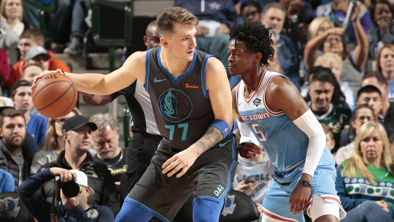 DALLAS, TX - DECEMBER 16: Luka Doncic #77 of the Dallas Mavericks handles the ball against De'Aaron Fox #5 of the Sacramento Kings on December 16, 2018 at the American Airlines Center in Dallas, Texas. Mandatory Copyright Notice: Copyright 2018 NBAE