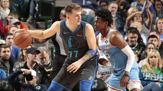 DALLAS, TX - DECEMBER 16: Luka Doncic #77 of the Dallas Mavericks handles the ball against De'Aaron Fox #5 of the Sacramento Kings on December 16, 2018 at the American Airlines Center in Dallas, Texas. Mandatory Copyright Notice: Copyright 2018 NBAE