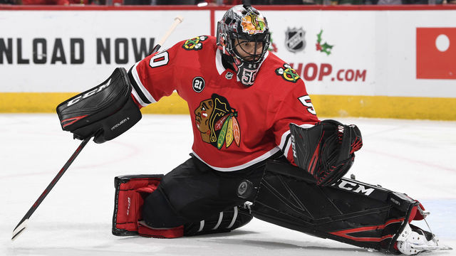 CHICAGO, IL - DECEMBER 14: Goalie Corey Crawford #50 of the Chicago Blackhawks gets in position to stop the puck in the second period against the Winnipeg Jets at the United Center on December 14, 2018 in Chicago, Illinois.