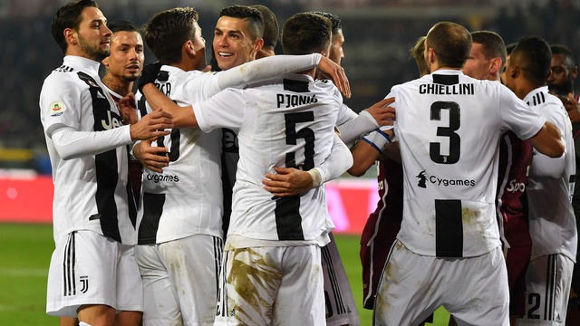 TURIN, ITALY - DECEMBER 15: Cristiano Ronaldo (C) of Juventus celebrates after scoring the opening goal from the penalty spot with team mates during the Serie A match between Torino FC and Juventus at Stadio Olimpico di Torino on December 15, 2018 in Turin, Italy.