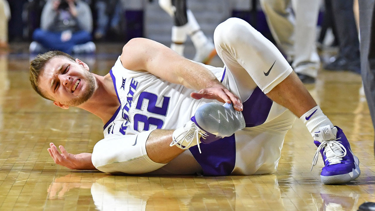 MANHATTAN, KS - DECEMBER 15: Dean Wade #32 of the Kansas State Wildcats reacts after hurting his right foot during the second half against the Georgia State Panthers on December 15, 2018 at Bramlage Coliseum in Manhattan, Kansas.