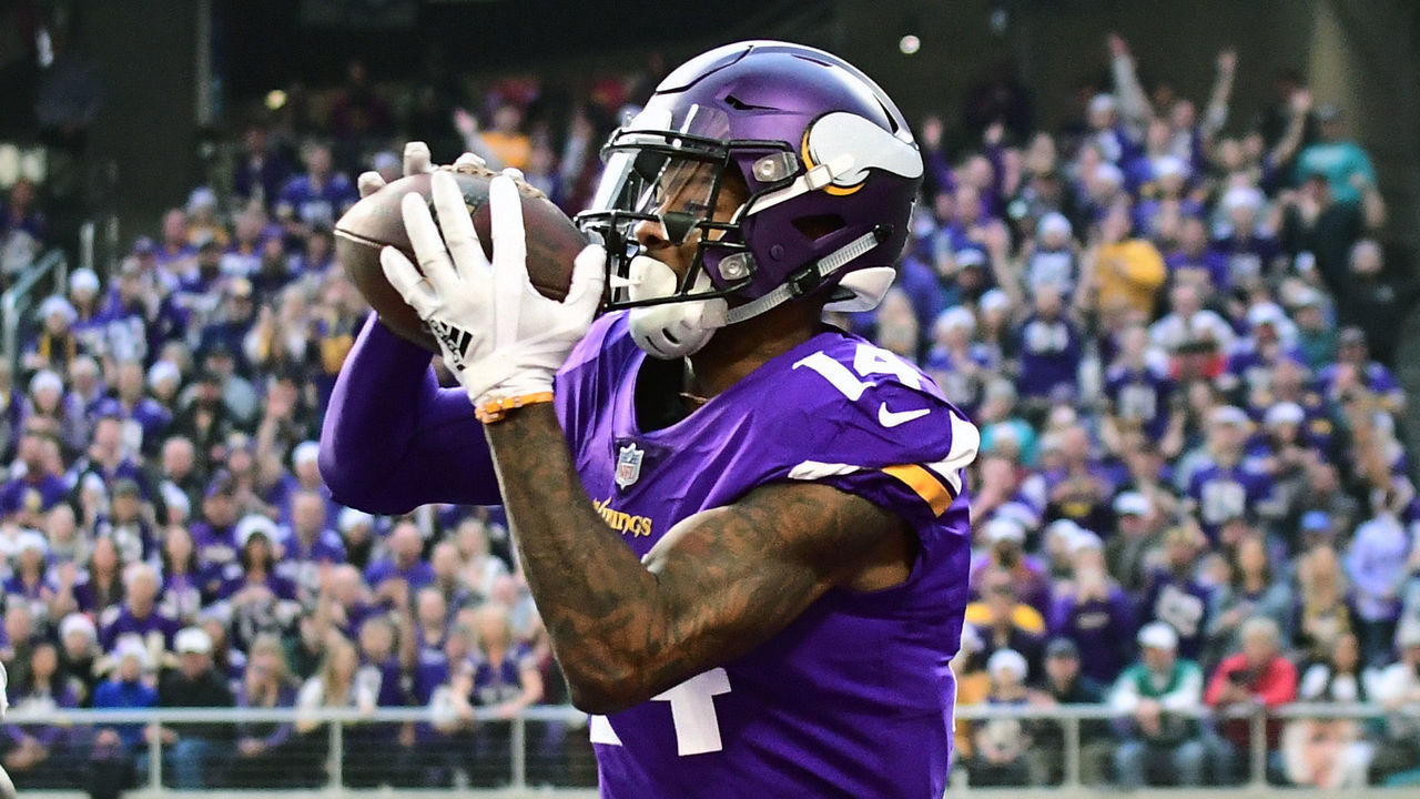 MINNEAPOLIS, MN - DECEMBER 16: Minnesota Vikings Wide Receiver Stefon Diggs (14) catches a touchdown pass from Minnesota Vikings Quarterback Kirk Cousins (8) in the 1st quarter an NFL game between the Minnesota Vikings and Miami Dolphins on December 16, 2018 at U.S. Bank Stadium in Minneapolis, Minnesota.