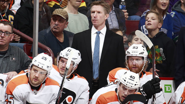 VANCOUVER, BC - DECEMBER 15: Head coach Dave Hakstol of the Philadelphia Flyers looks on from the bench during their NHL game against the Vancouver Canucks at Rogers Arena December 15, 2018 in Vancouver, British Columbia, Canada. Vancouver won 5-1.