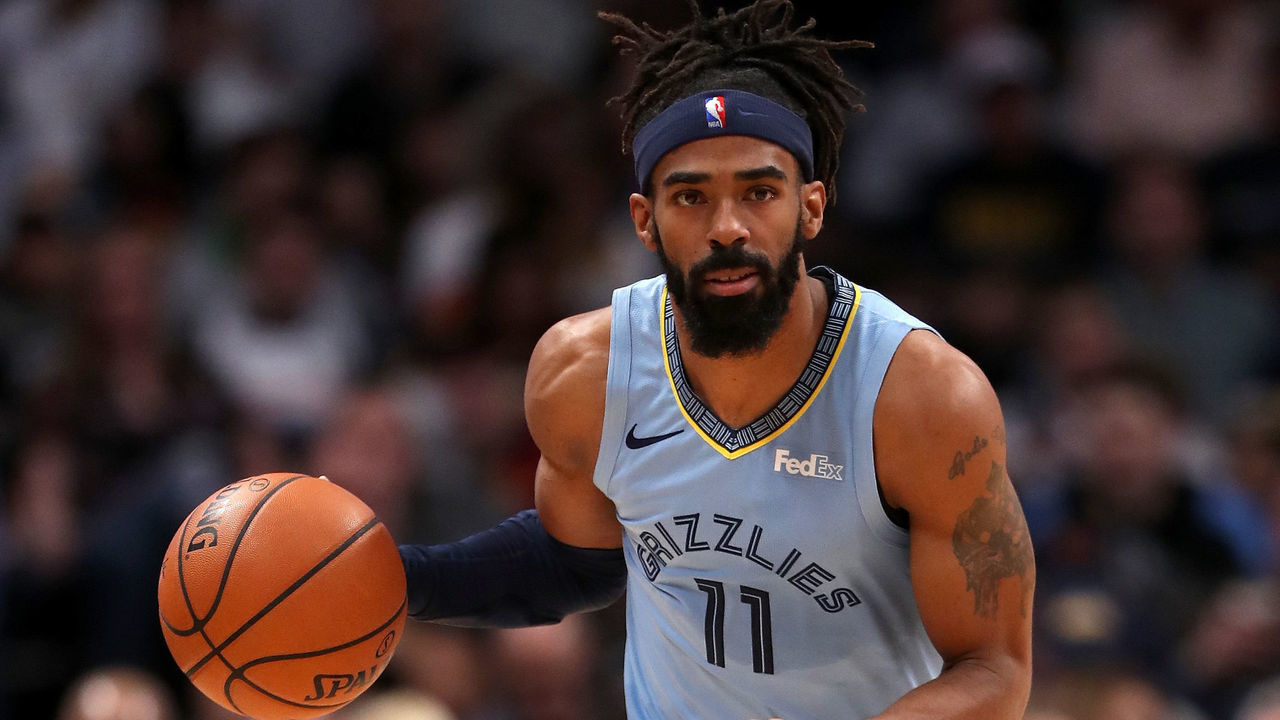 DENVER, CO - DECEMBER 10: Mike Conley #11 of the Memphis Grizzlies plays the Denver Nuggets at the Pepsi Center on December 10, 2018 in Denver, Colorado.