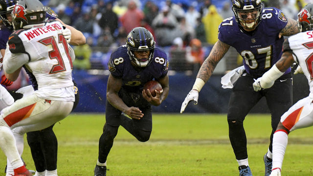 BALTIMORE, MD - DECEMBER 16: Baltimore Ravens quarterback Lamar Jackson (8) runs the ball against the Tampa Bay Buccaneers on December 16, 2018, at M&T Bank Stadium in Baltimore, MD.